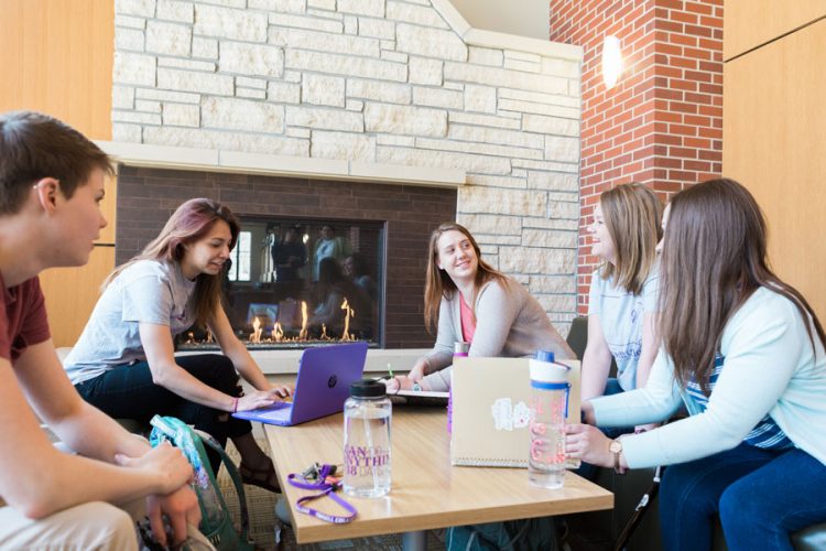 Jillian Drury Nash '19, Marisa Flores ’19, MaryJo Schmidt ’20, Zoe Randall ’20, and Gabrielle Zeger '21 (from left) gather in the lobby of the Thomas Commons.