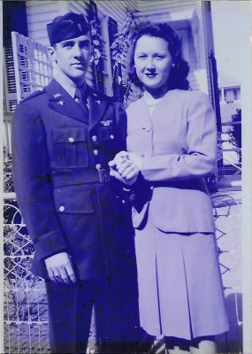 A black and white photo of Fred and Peggy standing together from 1944.