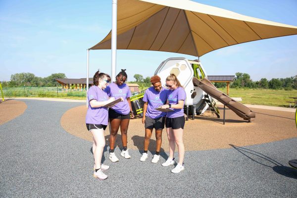 (Left to right) Carissa Meis, Ani’ja Simmons, A’ryn Jackson, and Kaylynn Sparks work together at a Linn County playground. Photo by Megan Amr.