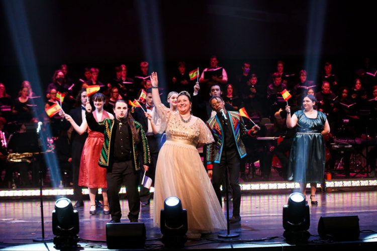 More than 100 students collaborated to bring the excitement of “Evita: In Concert” to the Kimmel Theatre stage last spring. Seventeen student singers and dancers were joined by the musical talents of Cornell’s Symphonic Band, Chamber Orchestra, Concert Choir, and Chamber Singers. The show also featured multiple actors in each role—in the same performance. From left in the front are Sam Dolinsek ’24 (as Che 1), Sophia Mitchell ’24 (as Evita) and Tre Austin ’25 (as Che 2). Photo by Megan Amr.