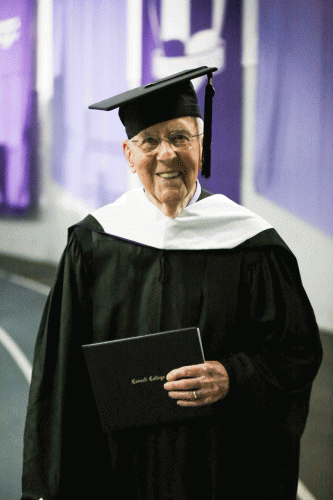 Fred Taylor '43 pictured holding his Cornell college diploma at the 2023 commencement