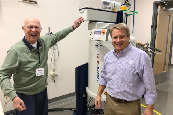 Professors Addison Ault and Charley Liberko with the new NMR in 2019.