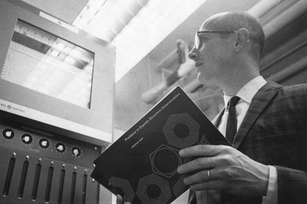 Undated photo of Addison Ault holding his latest textbook. Cornell Archives photo.