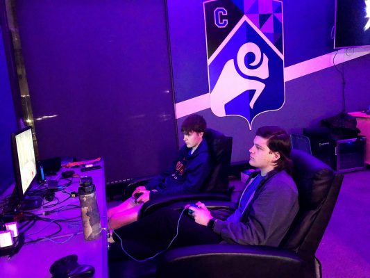 Camden (right) and Arjay Jacobs play a practice set in the Cornell Esports Arena.