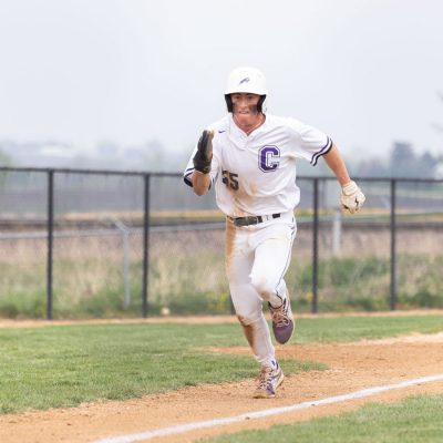 Vince Zipperer ’25 runs for the base. Photo by Ray Borchert ’24.