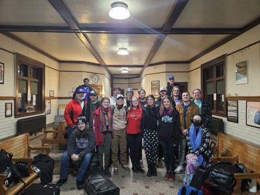 The Cornell Skiing and Snowboarding Club members pose for a photo in Mount Pleasant, Iowa as they depart for Colorado.