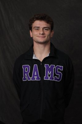 Landon Card smiling at the camera for a photo wearing a Cornell Rams sweatshirt