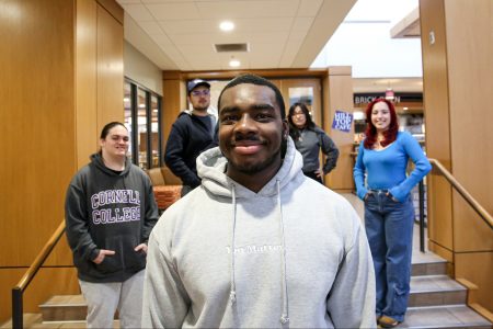 Bryce Stevens ’26 (center) is seen with members of his Posse—a group selected by the Posse Foundation and Cornell College. From left: Luis Ubilla ’26, Gabriel Muñoz ’26, Stevens, Nikauly Rios ’26, and Evelyn Benavides ’26. Photo by Megan Amr.