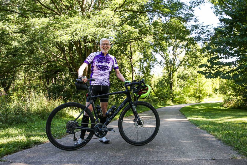 Craig Allin next to his road bike.