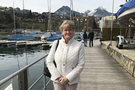 Dana Dahl Touzelet ’81 stands near ships in Spiez, Switzerland..