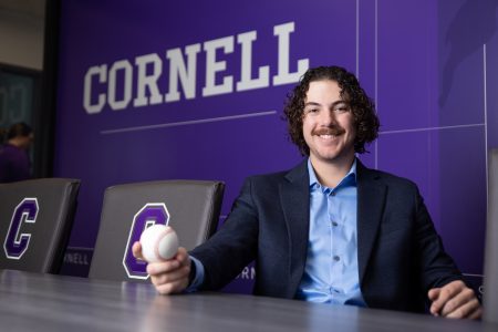 Cornell baseball player and chair of the NCAA Student-Athlete Advisory Committee Jack Langan holds a baseball while sitting in the Ellen Whale Conference Room in the Richard and Norma Small Athletic and Wellness Center.