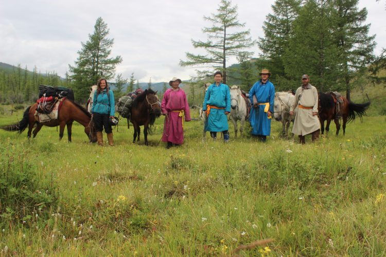 Julia Clark ’06 with colleagues in Mongolia, all with horses.