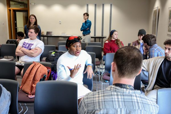 MkpoutoAbasi James speaks to a small circle of students.