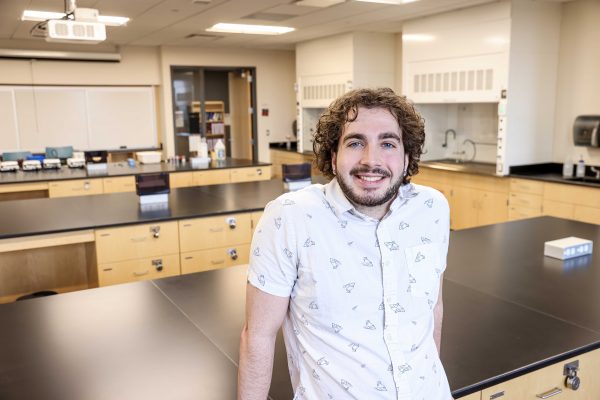 Ryan stands in Russell Science Center.