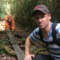 Scott Smiley 96 with an Orangutan in Kalimantan (Borneo), Indonesia