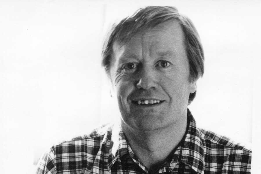 Professor Emeritus Gordon Urquhart headshot in checked shirt