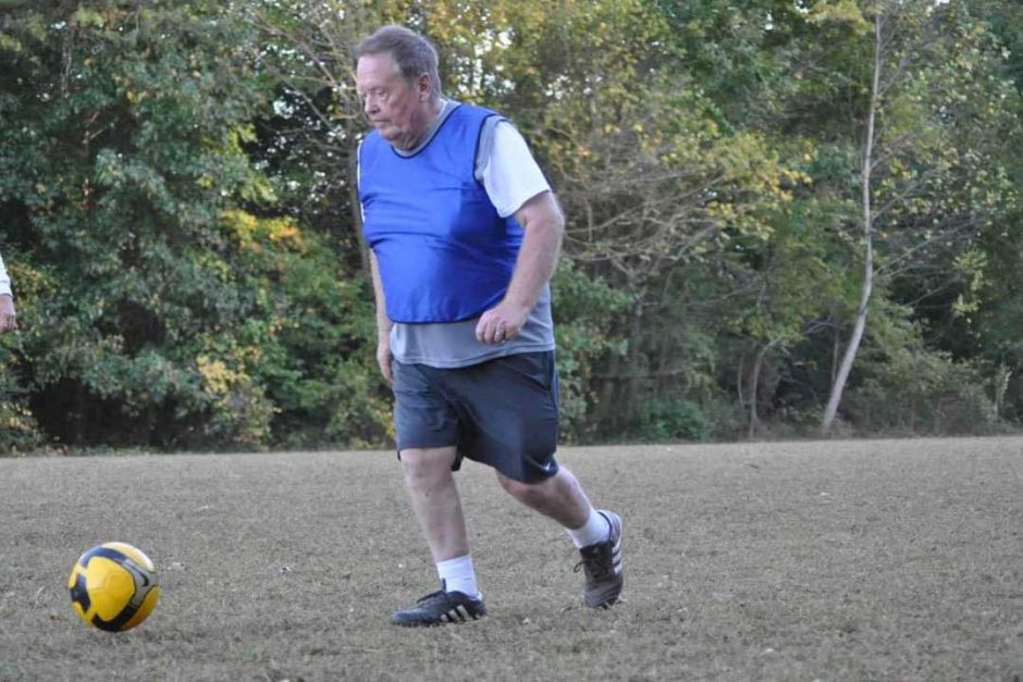 Professor Emeritus Gordon Urquhart plays soccer.