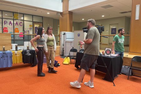 Two students getting interviewed by the local news.