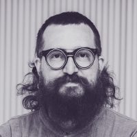 Harper Reed 01 with heavy glasses and beard, in black and white