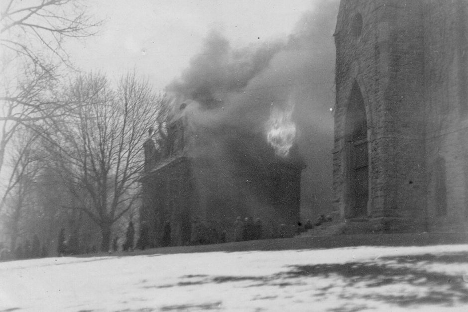 Flames and smoke burst from Old Sem during the 1924 fire that gutted the 1853 building.