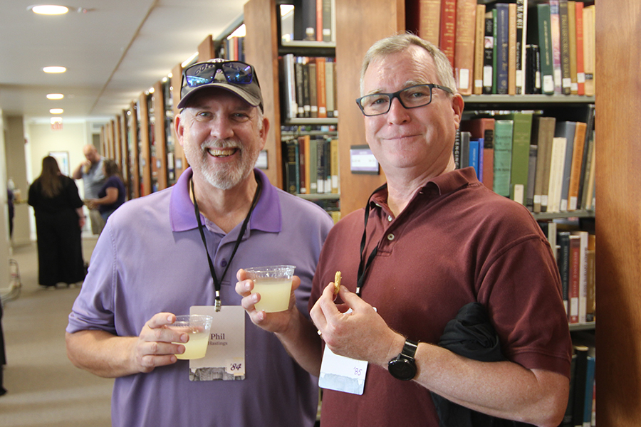 Phil Hastings '84 and Paul Beaumaster '85 at The Cornellian Retrospective and Reunion in Cole Library.