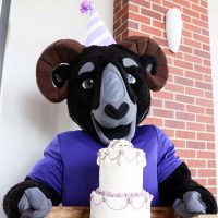 Ulysses holds his birthday cake.